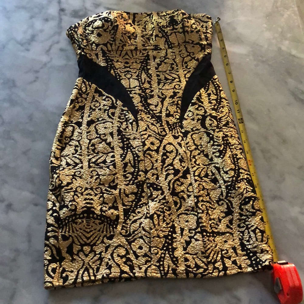 Black and gold body con mini dress